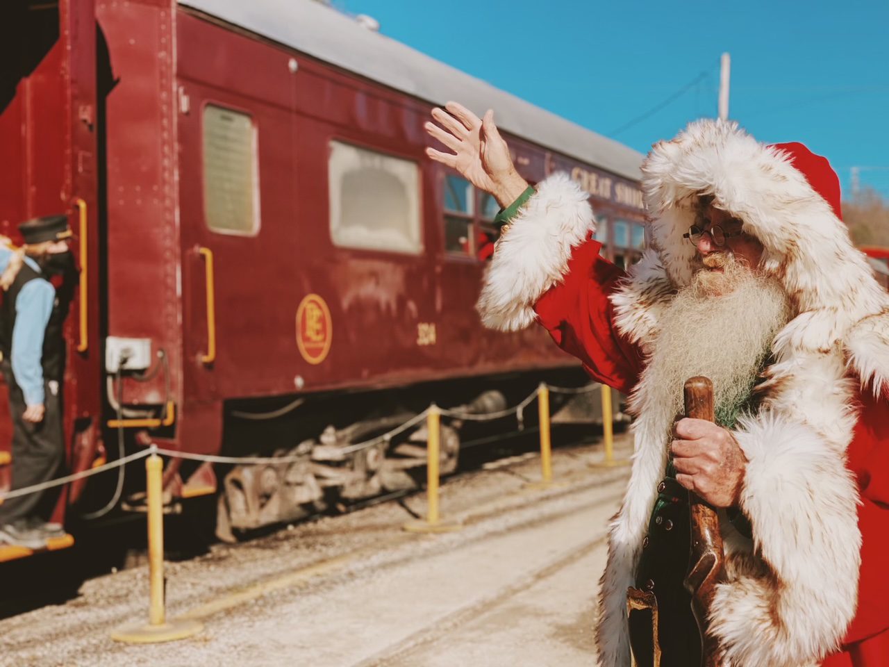 Santa waves at passengers on the Great Smoky Mountain Railroad