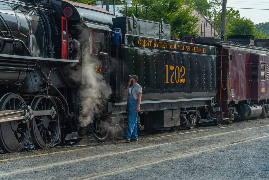 A train prepares to depart from The Great Smoky Mountains Railroad in Bryson City.