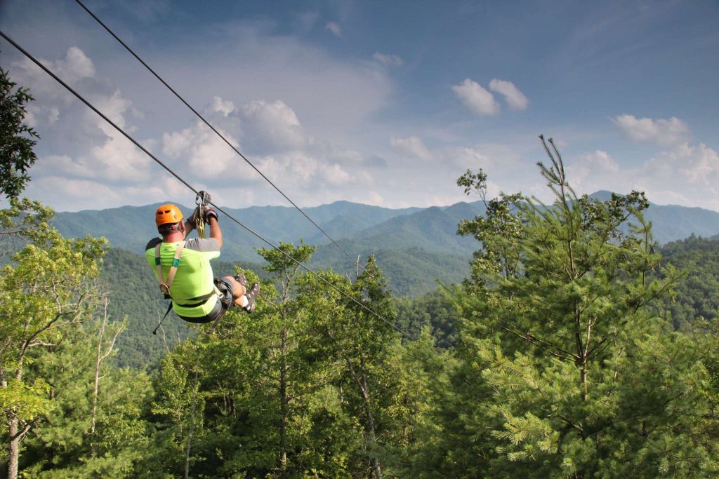 Guy ziplining in the Smoky Mountains