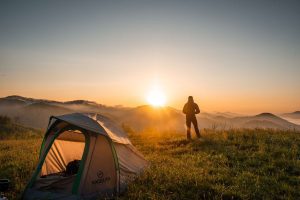 person watching the sunset while camping in the smoky mountains