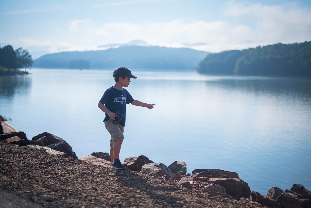 Child playing by Lake Chatuge near Hayesville NC