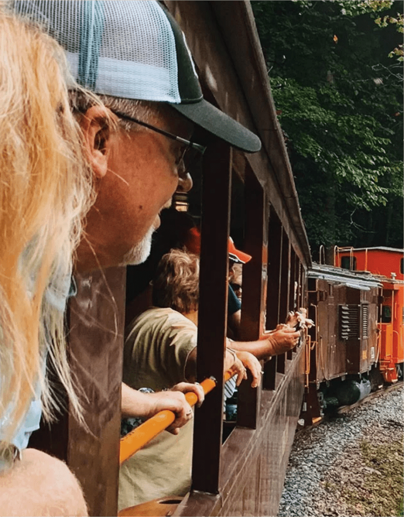 people riding a train in the great smoky mountains of NC