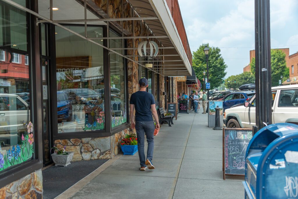 shopper walking down street in downtown franklin nc