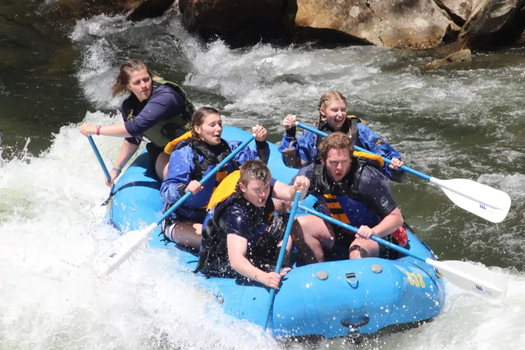 people riding in a boat on a whitewater adventure tour in the Great Smoky Mountains of North Carolina