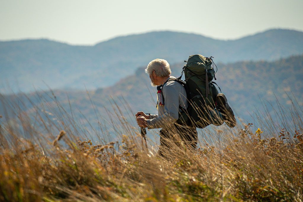 hiker on the Appalachian Trail at Graveyard Fields.