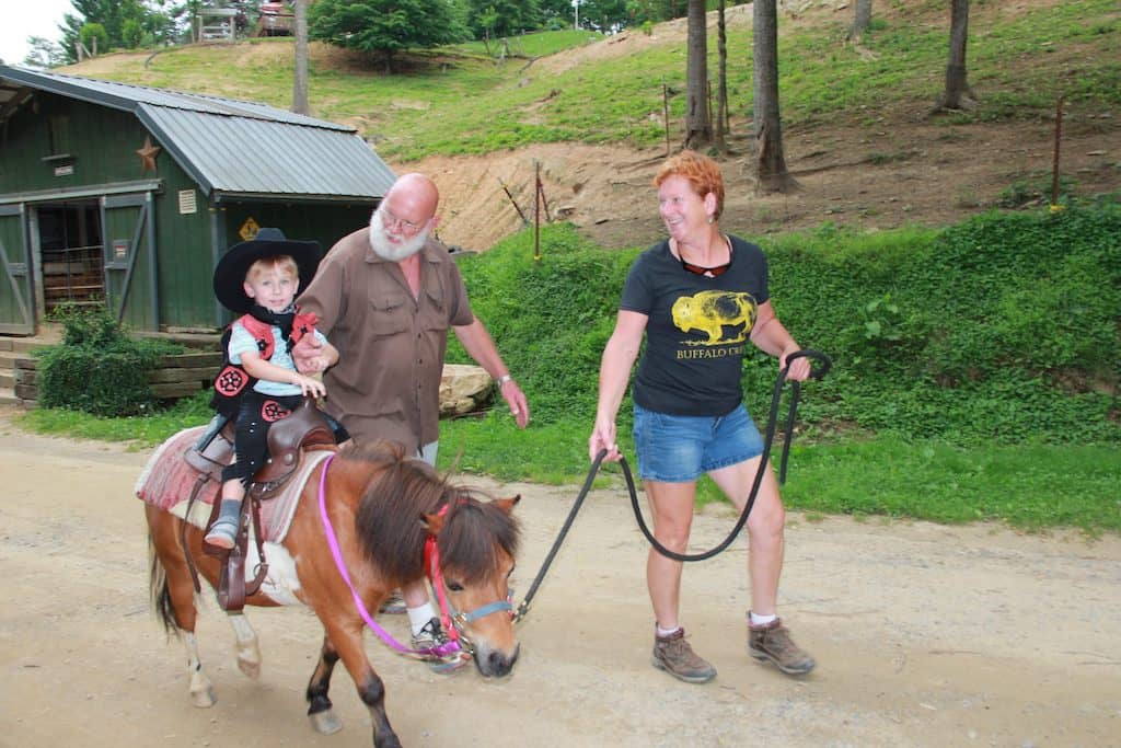 A kid rides a pony at Buffalo Creek Vacations in Haywood County, NC.